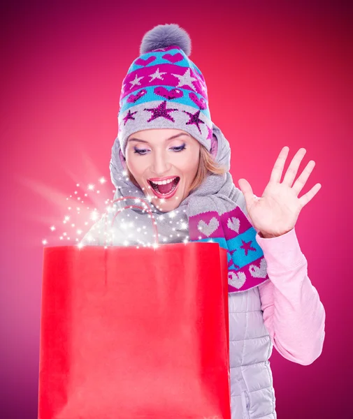 Surprised woman with gifts
