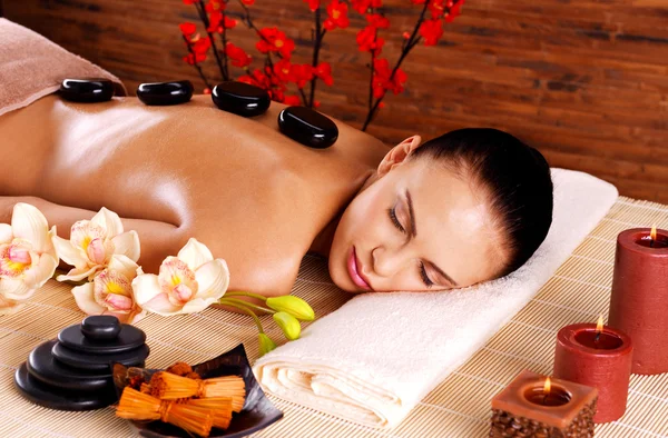 Adult woman relaxing in spa salon