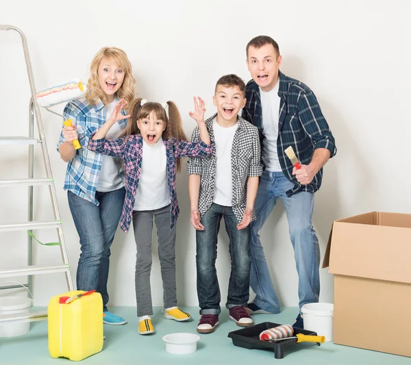 Happy family makes repairs at home
