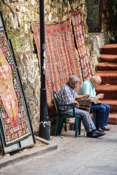 Old men checking their cellphones
