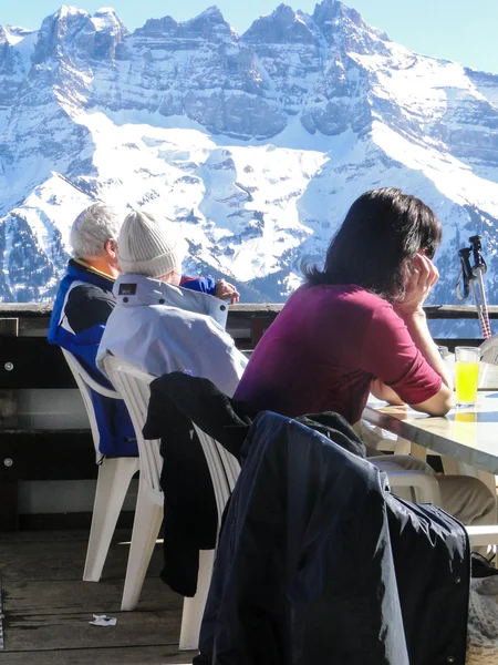 Skiers relax at a high mountain restaurant