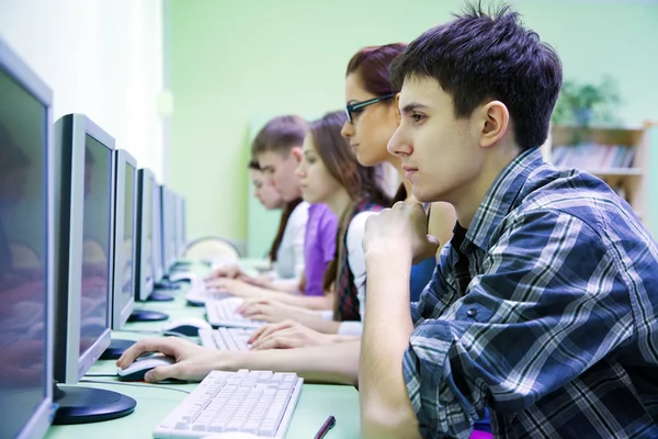 Group of students studying with computer