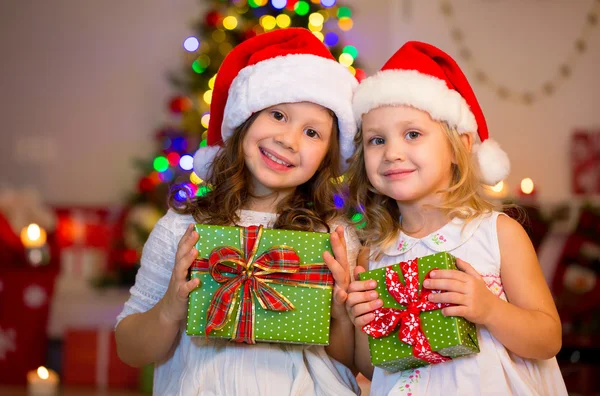 Little girls in Santa hats