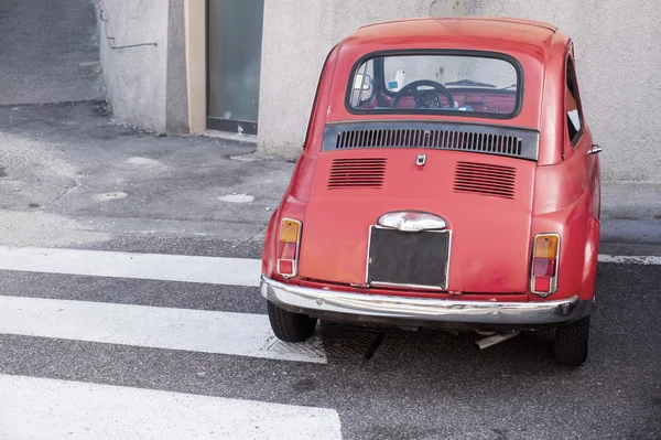 TRIESTE, ITALY - MARCH, 19: Fiat 500, old Italian car parked next to the pedestrian crossing on March 19, 2016