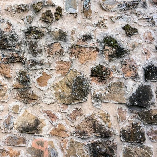 Stone wall with mold stains