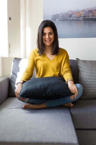 Woman relaxing in the living room