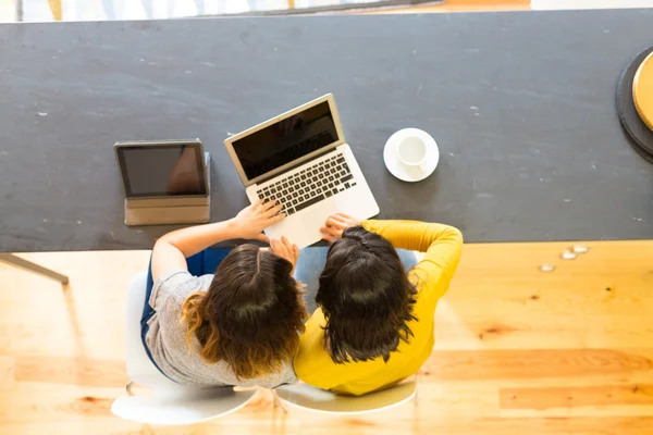 Women using laptop at home