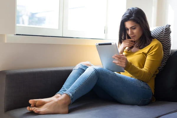 Woman relaxing at the living room