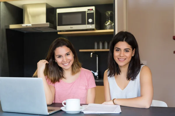 Women using laptop at home