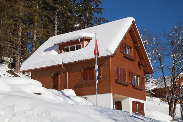 House in winter Swiss Alps