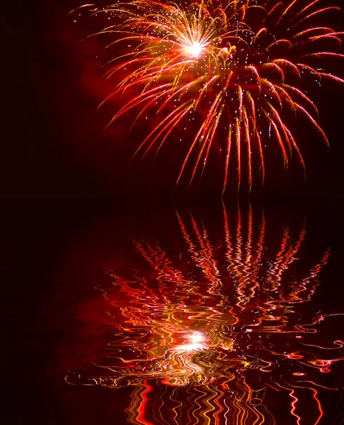 Sparks fireworks water reflection