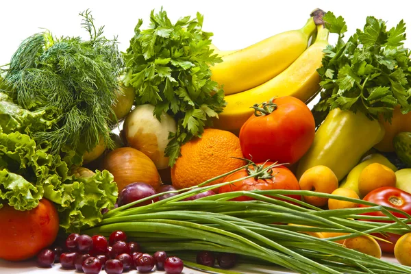 Still life of vegetables melon cherry orange parsley pepper plum