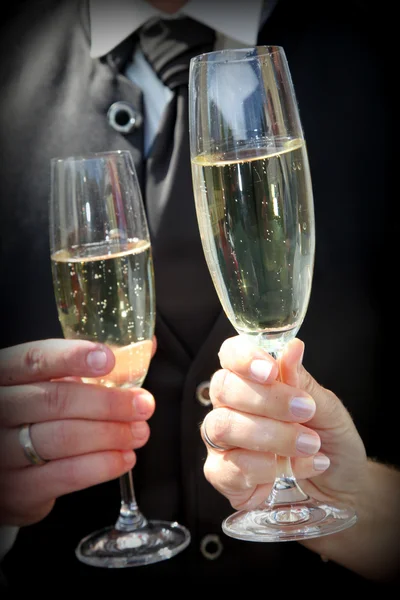 Close Up of Bride and Groom Toasting Champagne