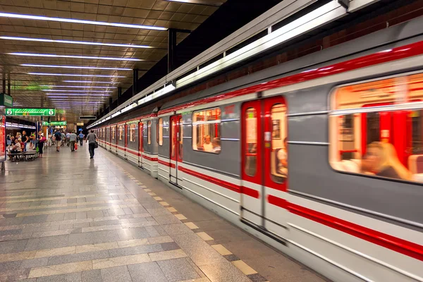 Train leaves metro station in Prague.