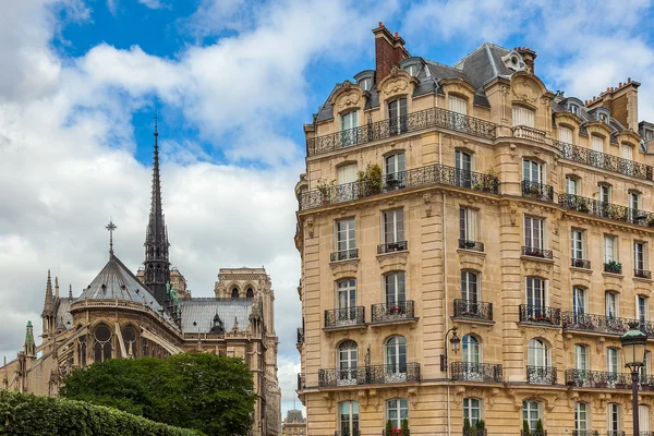 Parisian building and Notre Dame de Paris Cathedral.