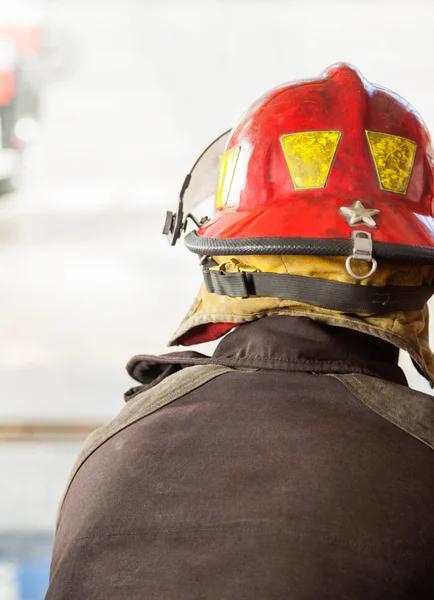 Firefighter In Red Helmet