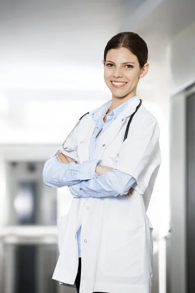 Female Doctor Standing Arms Crossed At Rehab Center