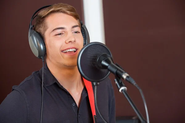 Singer Performing While Looking Away In Studio