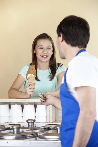 Girl Paying For Chocolate Ice Cream To Waiter
