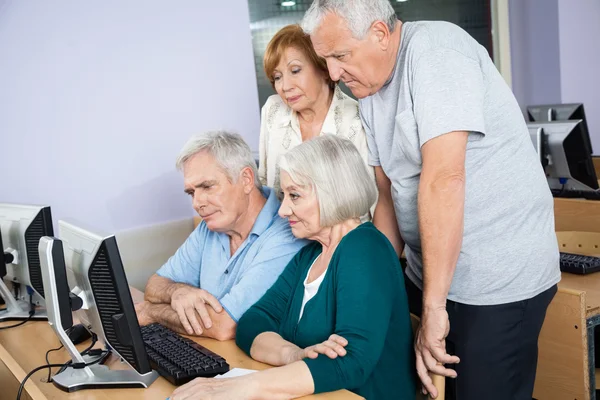 Senior People Using Computer In Lab