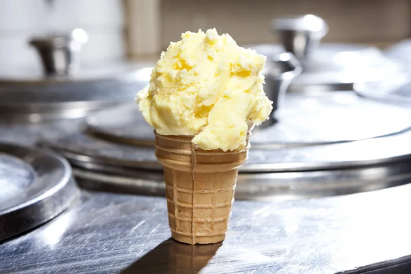 Vanilla Ice Cream In Cone On Counter At Shop
