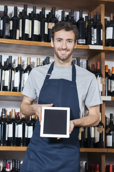 Salesman Showing Blank Digital Tablet In Wine Shop
