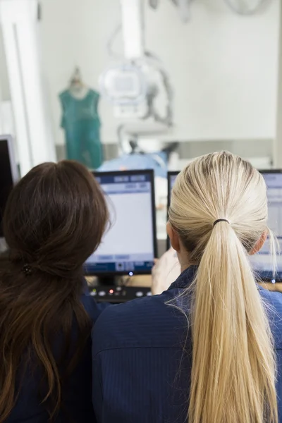 Female radiologists using computers