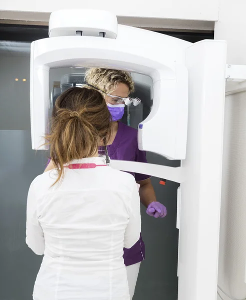 Dentist And Patient Using Xray Machine