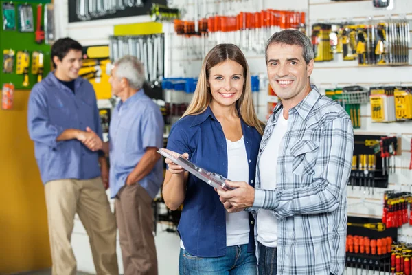 Couple Buying Tool Set In Hardware Store