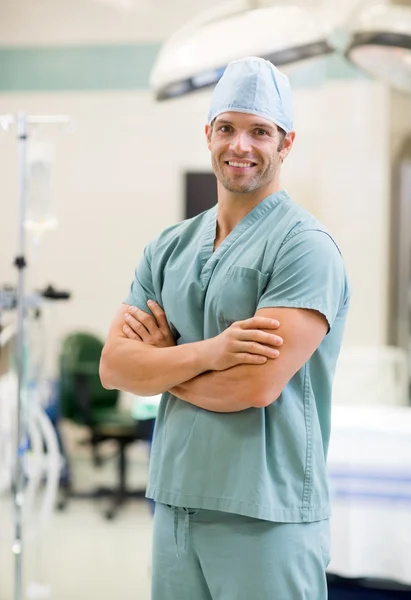 Smiling Surgeon Standing Arms Crossed