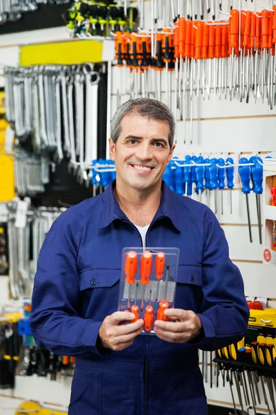 Confident Worker Holding Screwdriver Package