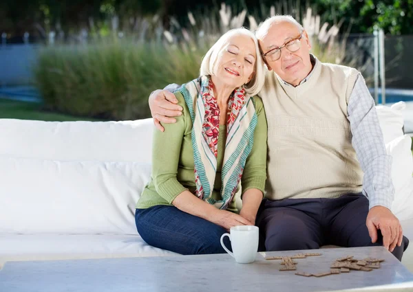 Relaxed Senior Man Sitting On Couch At Nursing Home Porch