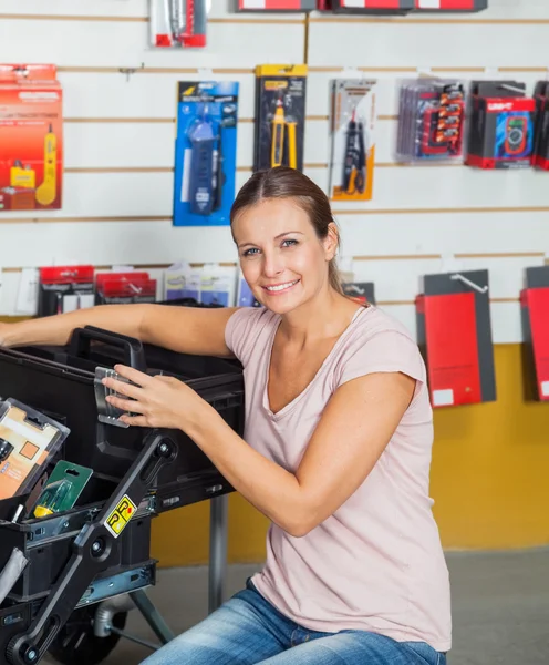 Woman Buying Tools In Hardware Store