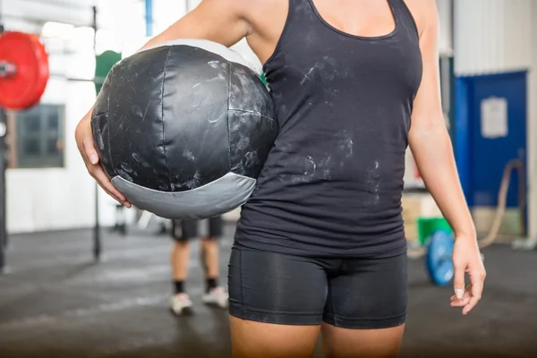 Athlete Carrying Medicine Ball At Gym
