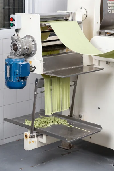 Spaghetti Pasta Being Processed In Automated Machine