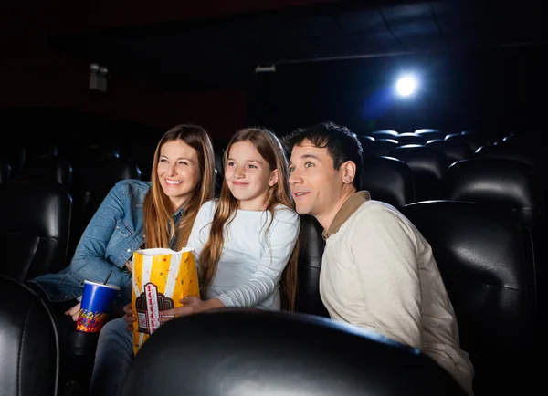 Family Watching Movie In Cinema Theater