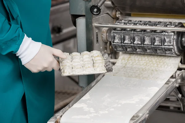 Chef Holding Ravioli Pasta Tray By Machinery