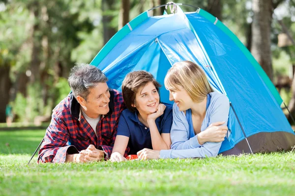 Smiling Family Camping In Park