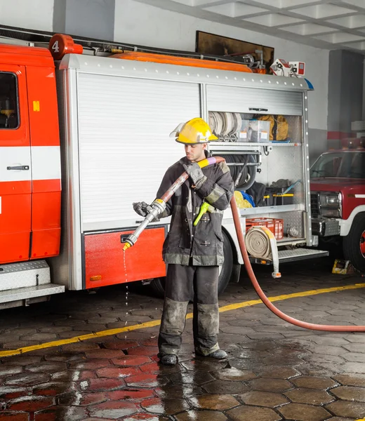 Fireman Holding Water Hose During Training