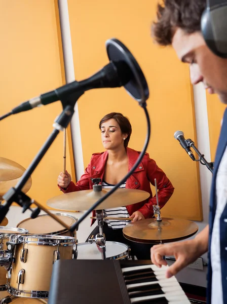 Female Drummer Performing With Male Pianist