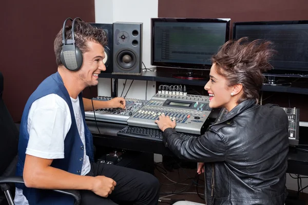 Professionals Mixing Audio In Recording Studio