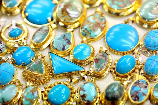 Golded jewel with turquoise