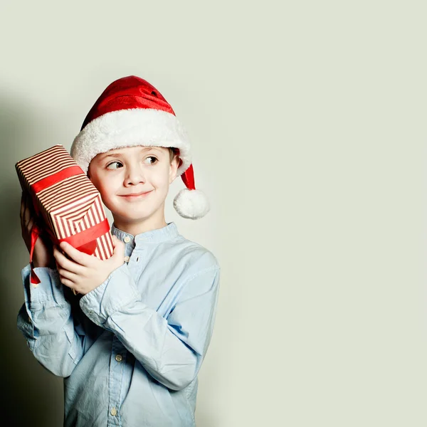 Christmas Child Boy and Xmas Gift. What is in the Gift Box?