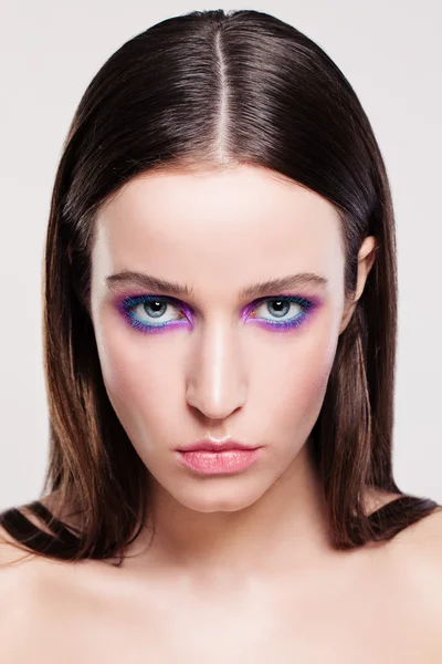 Young Woman Face. Makeup and Brown Hair