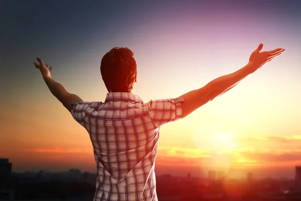 Successful man looking up to sky