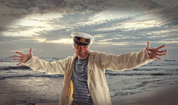 Happy sailor man on ocean background