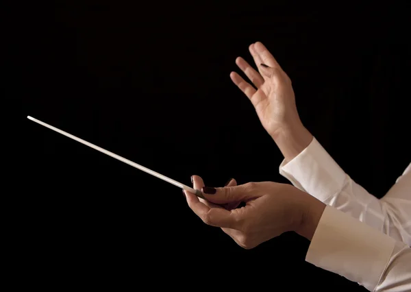 Music female director holding stick