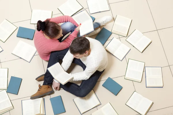 Woman and man reading book