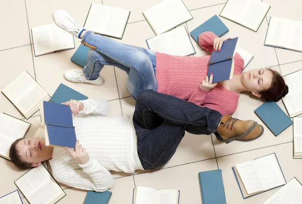 Woman and man reading book