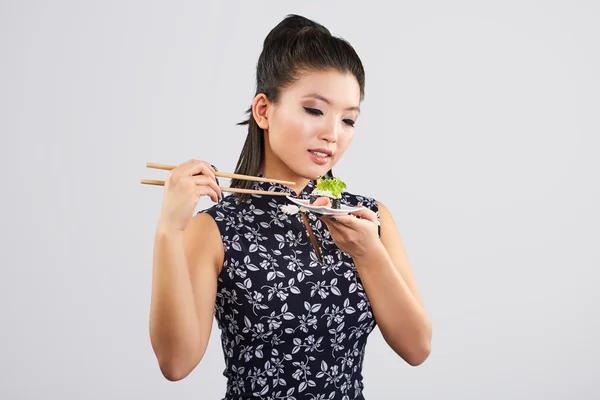 Sushi woman holding sushi